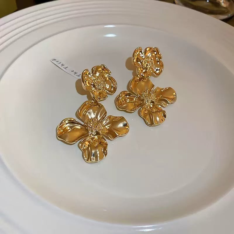 The Romantic Dance of Cream White Dress and Gilded Petals