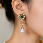 Pearl flowers illuminate your face, radiating elegance by your ears.