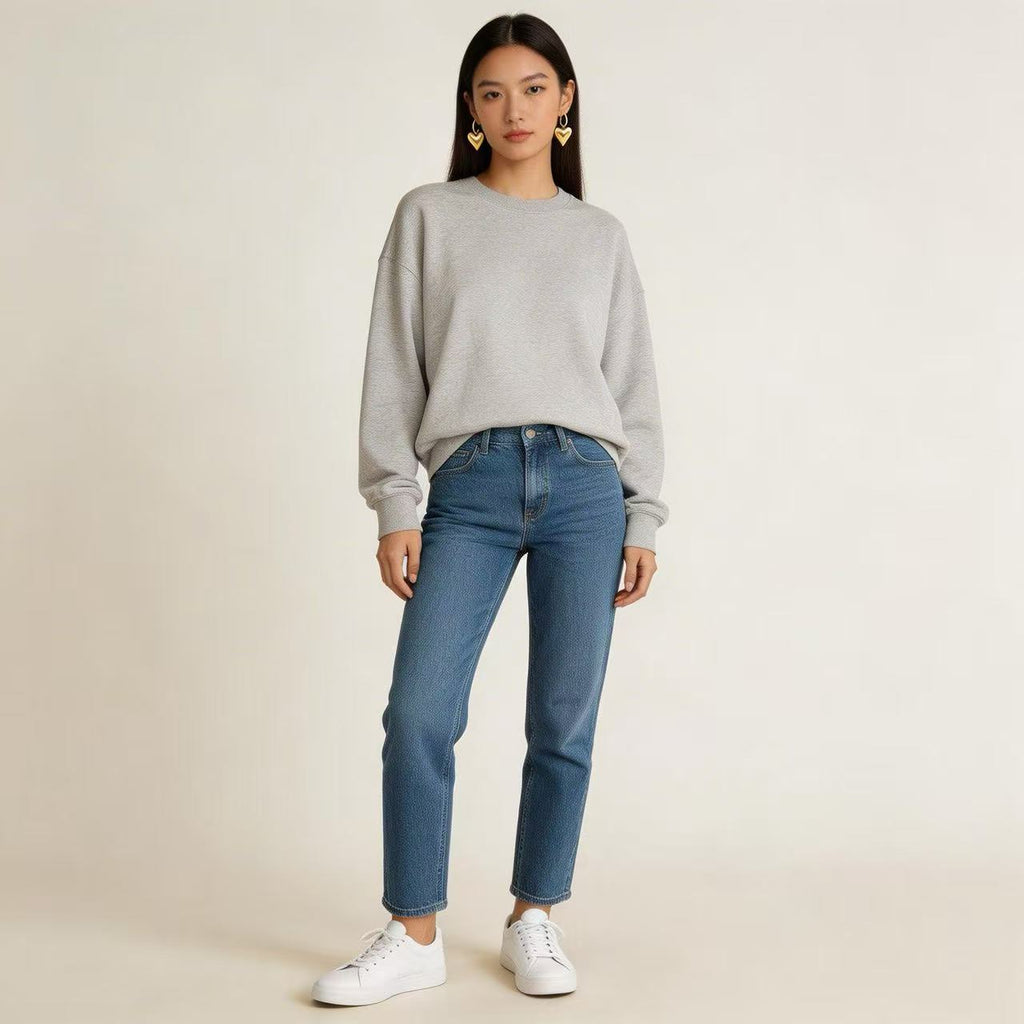 The sophisticated code of a hoodie, jeans, and heart-shaped earrings