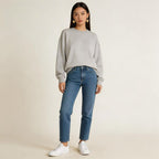 The sophisticated code of a hoodie, jeans, and heart-shaped earrings