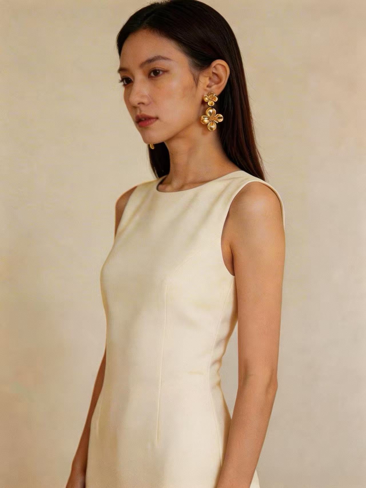 The Romantic Dance of Cream White Dress and Gilded Petals