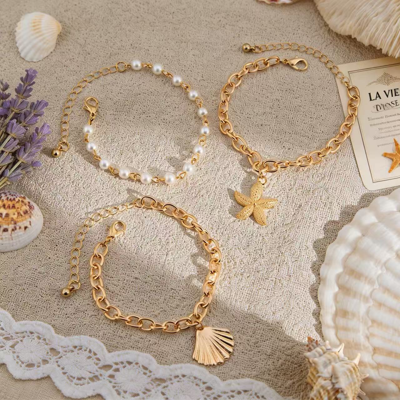 Seaside romance: starfish shell bracelet meets white dress